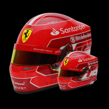 Load image into Gallery viewer, A miniature replica of a Formula 1 racing helmet, predominantly red with sponsor logos, designed to mimic the helmet of Charles Leclerc.
