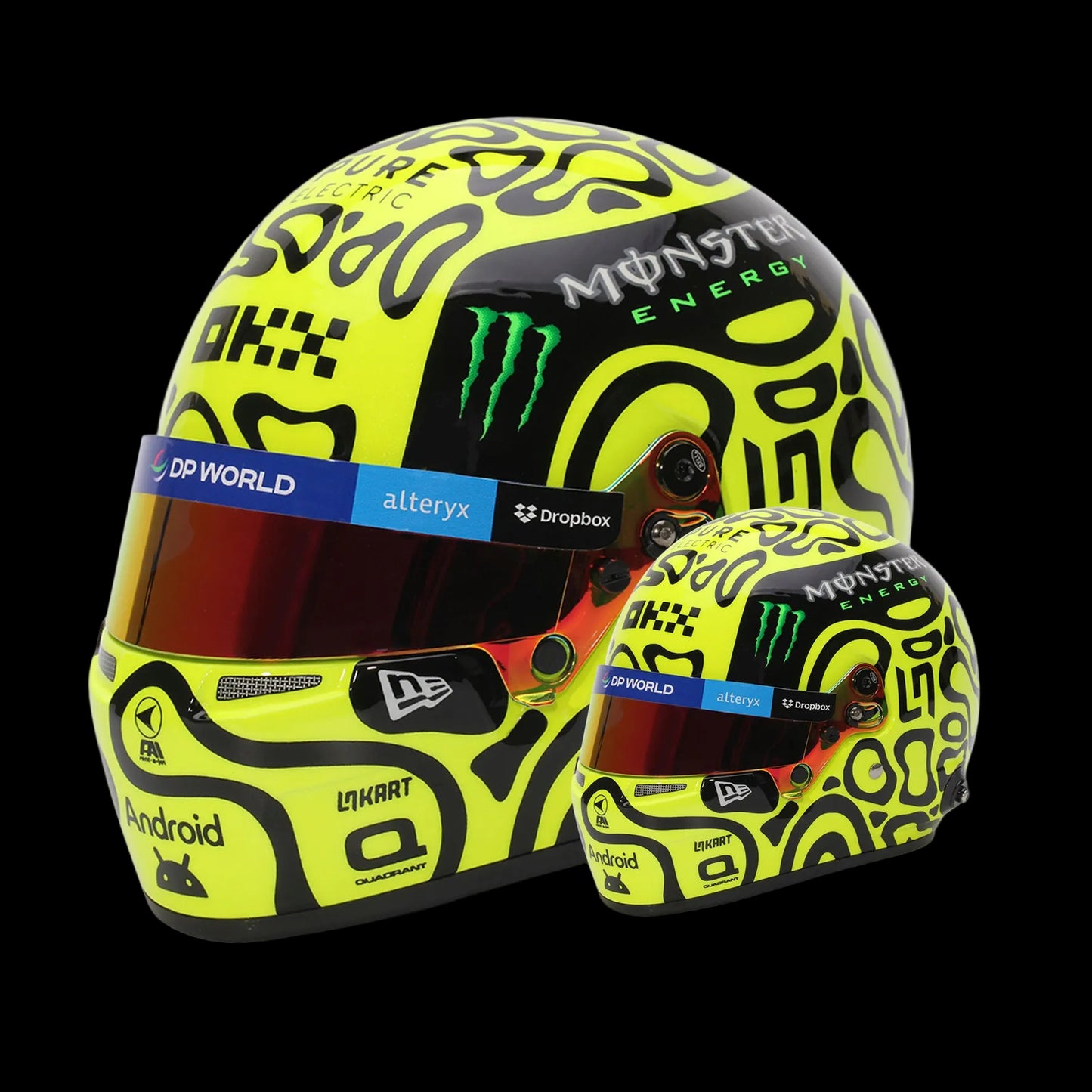 A 1:2 scale replica of Lando Norris' 2024 F1 helmet with a yellow, black, and green psychedelic pattern, including sponsor logos.