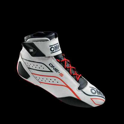 A white OMP 'ONE-S' circuit racing boot with red and black accents, featuring a Velcro ankle strap and branded with OMP logos.