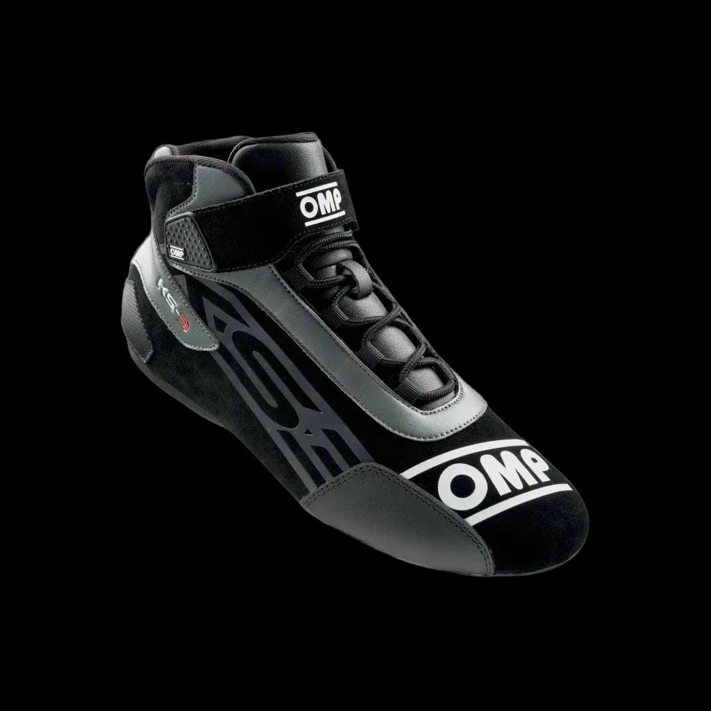 A pair of OMP KS-3 Kart Boots in black and white with visible brand logos, designed for karting with mesh inserts and technical reinforcements.