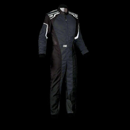 A black OMP KS-3 Kart Suit for KIDS, featuring a low-cut neck collar, long sleeves with contrasting white stripes, and two practical outer pockets.