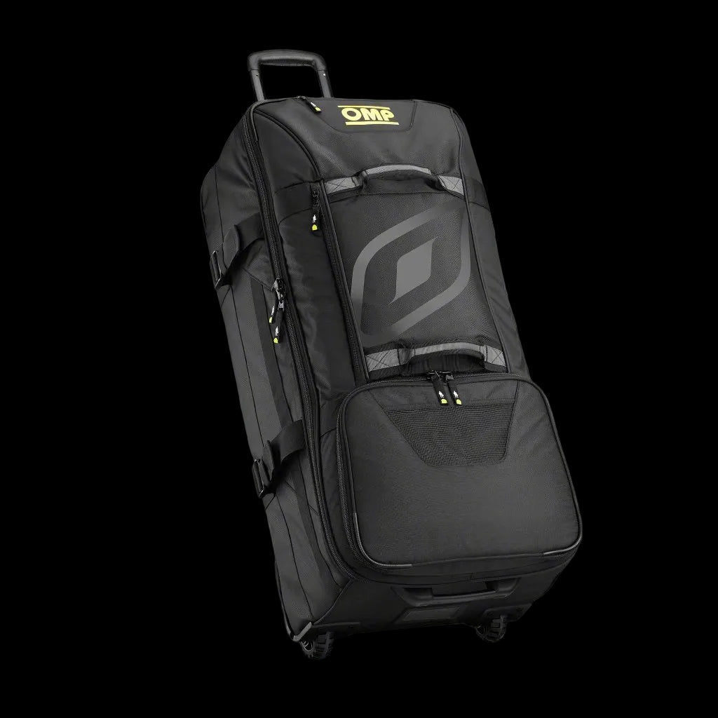 OMP Large Trolley Bag in black color with logos, featuring a double handle, resistant cargo wheels, and a rigid bottom.