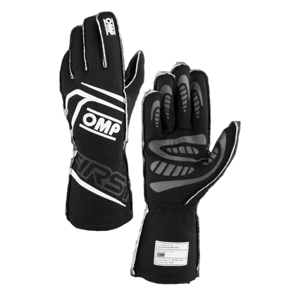 A pair of black OMP 'FIRST' Circuit Racing Gloves with visible brand logo and silicone palm for grip.