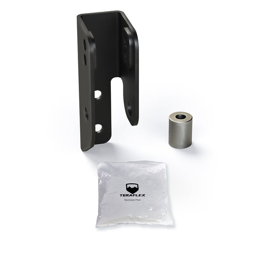 A black metal rear track bar axle bracket kit, including a bracket and a roll-up package with the Teraflex logo.